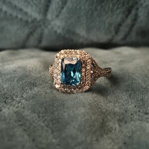 Elegant Blue Topaz Sterling Silver Emerald Cut Ring